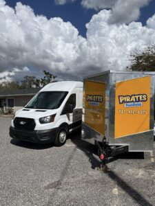 Pirates Plumbing service van and drain cleaning trailer in Dunedin FL